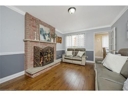 7 Calvert Drive, Georgetown, ON - Indoor Photo Showing Living Room With Fireplace