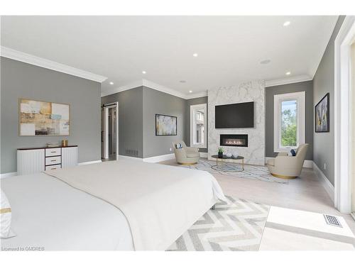 101 Perryman Court, Erin, ON - Indoor Photo Showing Bedroom With Fireplace