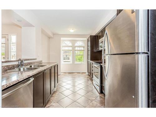 243 Septimus Heights, Milton, ON - Indoor Photo Showing Kitchen With Stainless Steel Kitchen With Double Sink