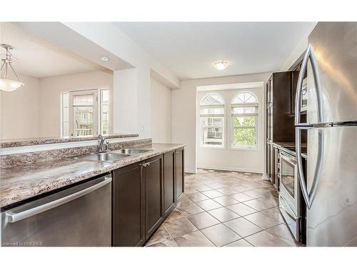 243 Septimus Heights, Milton, ON - Indoor Photo Showing Kitchen With Stainless Steel Kitchen With Double Sink