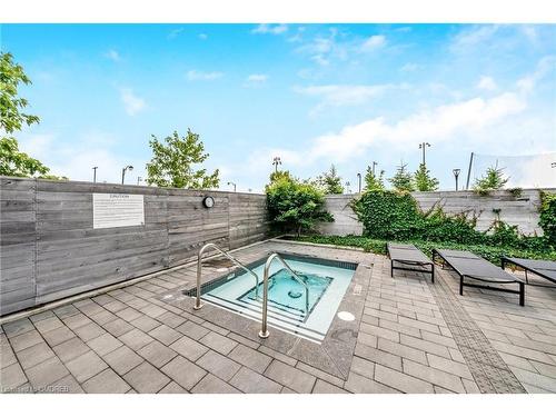 207-1050 Main Street E, Milton, ON - Outdoor With In Ground Pool