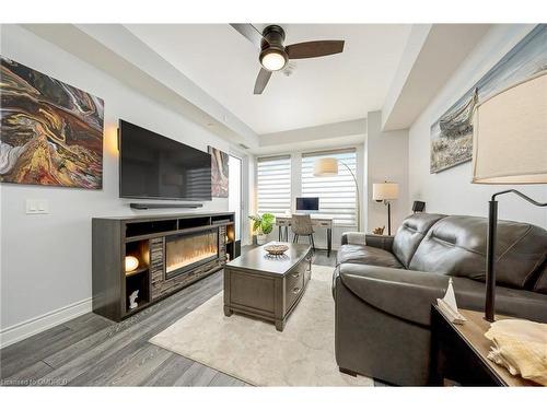 207-1050 Main Street E, Milton, ON - Indoor Photo Showing Living Room With Fireplace