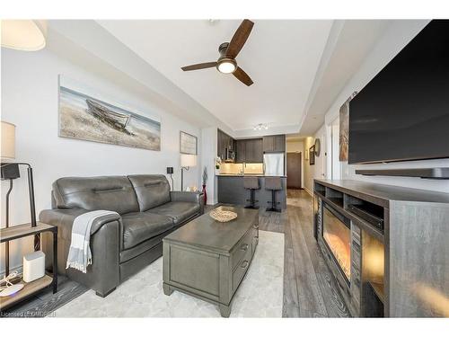 207-1050 Main Street E, Milton, ON - Indoor Photo Showing Living Room With Fireplace