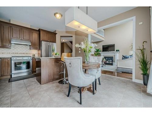 2240 Wuthering Heights Way, Oakville, ON - Indoor Photo Showing Kitchen With Fireplace With Stainless Steel Kitchen