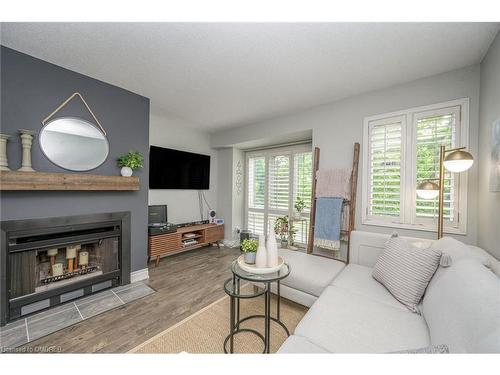 406-895 Maple Avenue, Burlington, ON - Indoor Photo Showing Living Room With Fireplace