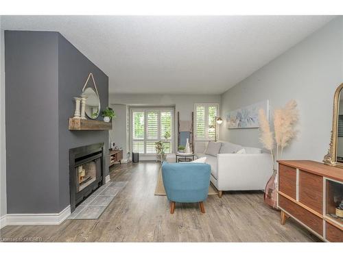 406-895 Maple Avenue, Burlington, ON - Indoor Photo Showing Living Room With Fireplace