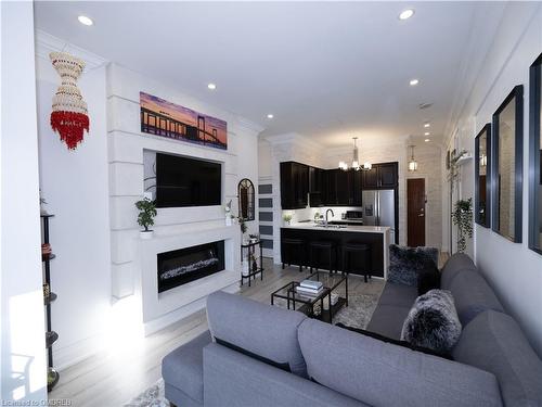Uph3108-4090 Living Arts Drive, Mississauga, ON - Indoor Photo Showing Living Room With Fireplace