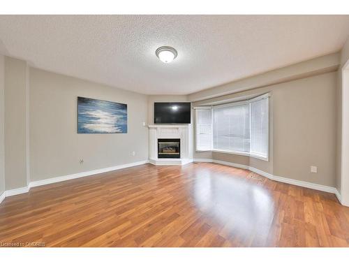 100 Fellowes Crescent, Waterdown, ON - Indoor Photo Showing Living Room With Fireplace