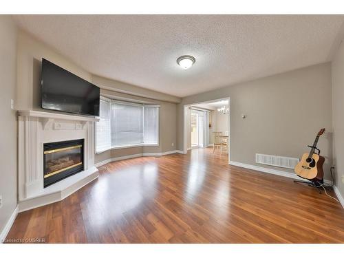 100 Fellowes Crescent, Waterdown, ON - Indoor Photo Showing Living Room With Fireplace