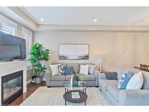 44-2019 Trawden Way, Oakville, ON - Indoor Photo Showing Living Room With Fireplace