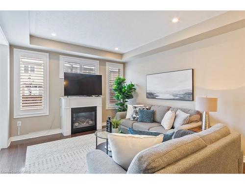 44-2019 Trawden Way, Oakville, ON - Indoor Photo Showing Living Room With Fireplace