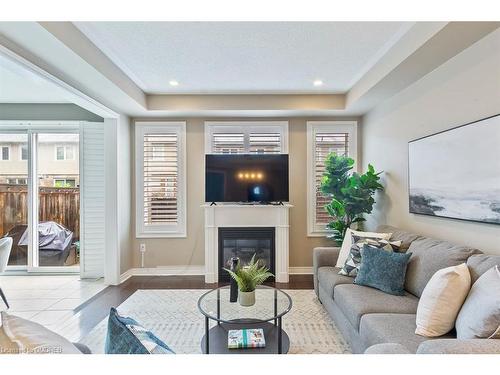 44-2019 Trawden Way, Oakville, ON - Indoor Photo Showing Living Room With Fireplace