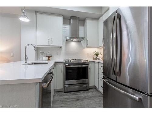 428-128 Grovewood Common, Oakville, ON - Indoor Photo Showing Kitchen With Stainless Steel Kitchen With Upgraded Kitchen