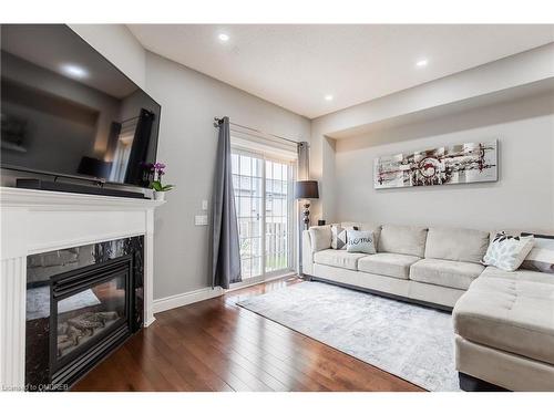 10-5080 Fairview Street, Burlington, ON - Indoor Photo Showing Living Room With Fireplace