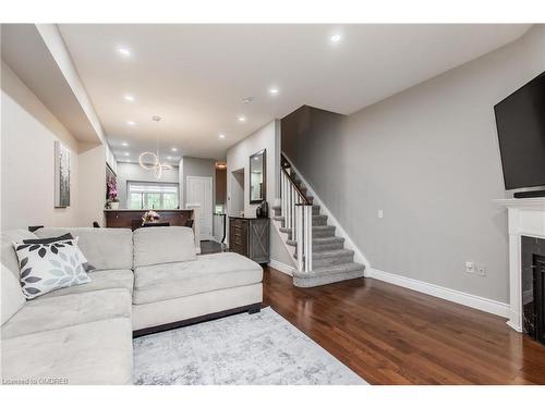 10-5080 Fairview Street, Burlington, ON - Indoor Photo Showing Living Room With Fireplace