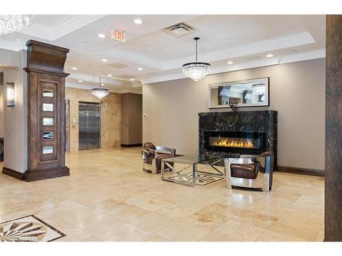 206-205 Lakeshore Rd Road W, Oakville, ON - Indoor With Fireplace