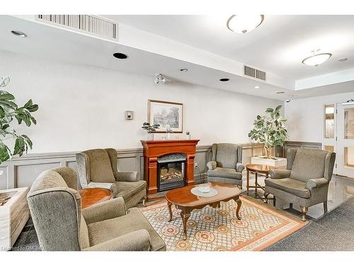 411-2199 Sixth Line, Oakville, ON - Indoor Photo Showing Living Room With Fireplace