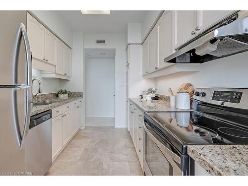 411-2199 Sixth Line, Oakville, ON - Indoor Photo Showing Kitchen With Stainless Steel Kitchen With Double Sink With Upgraded Kitchen