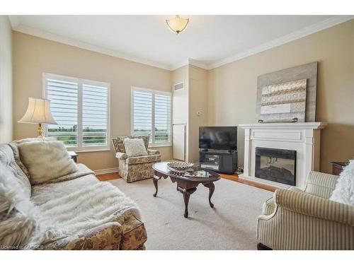 509-1499 Nottinghill Gate, Oakville, ON - Indoor Photo Showing Living Room With Fireplace