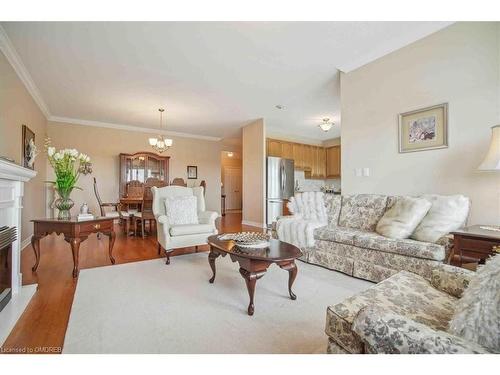 509-1499 Nottinghill Gate, Oakville, ON - Indoor Photo Showing Living Room With Fireplace