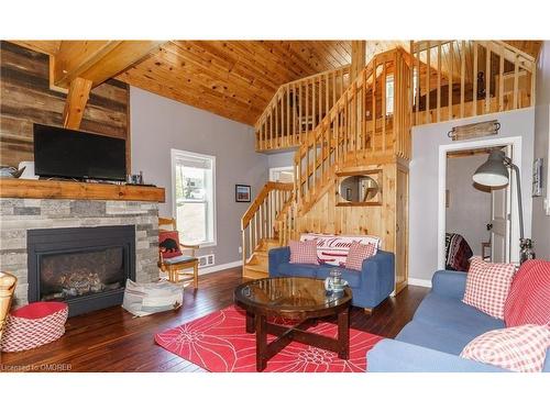 684A South Shore Road, South River, ON - Indoor Photo Showing Living Room With Fireplace