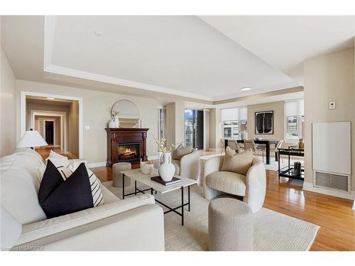 512-65 Port Street E, Mississauga, ON - Indoor Photo Showing Living Room With Fireplace