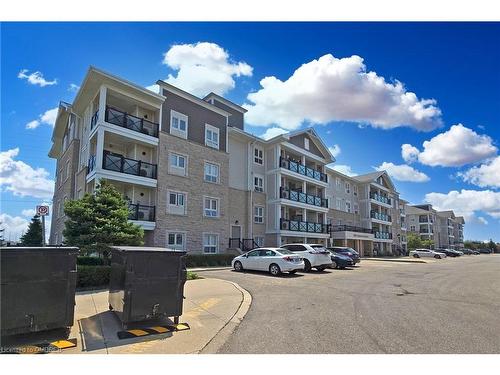 305-1005 Nadalin Heights, Milton, ON - Outdoor With Balcony With Facade