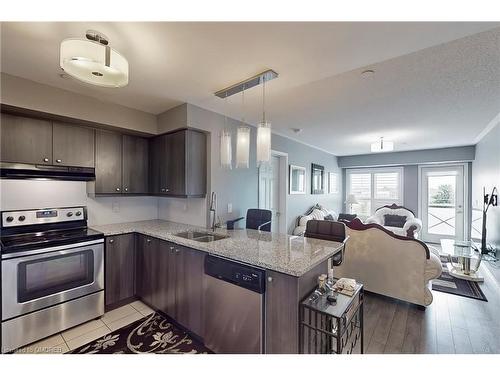 305-1005 Nadalin Heights, Milton, ON - Indoor Photo Showing Kitchen With Stainless Steel Kitchen With Double Sink