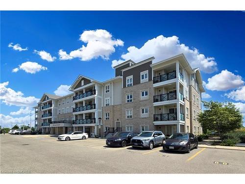 305-1005 Nadalin Heights, Milton, ON - Outdoor With Balcony With Facade