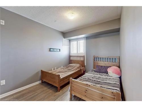 305-1005 Nadalin Heights, Milton, ON - Indoor Photo Showing Bedroom