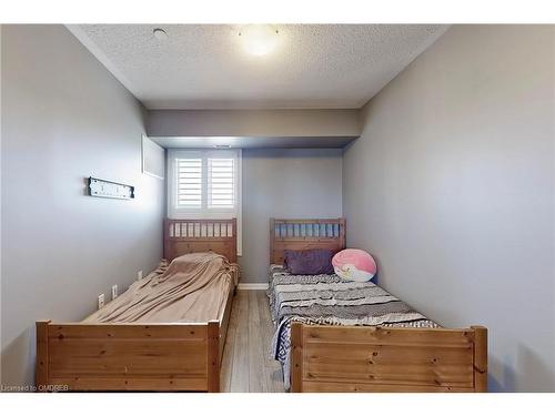 305-1005 Nadalin Heights, Milton, ON - Indoor Photo Showing Bedroom