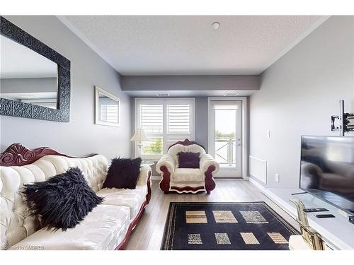 305-1005 Nadalin Heights, Milton, ON - Indoor Photo Showing Living Room