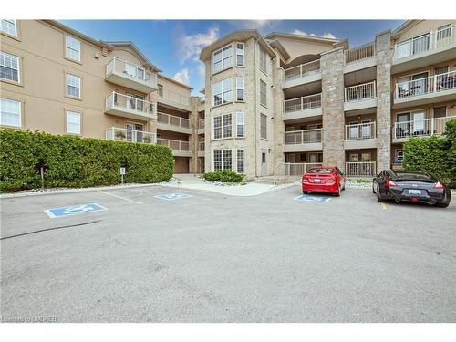 210-1460 Bishops Gate, Oakville, ON - Outdoor With Balcony With Facade