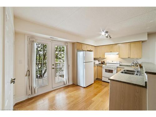 210-1460 Bishops Gate, Oakville, ON - Indoor Photo Showing Kitchen With Double Sink