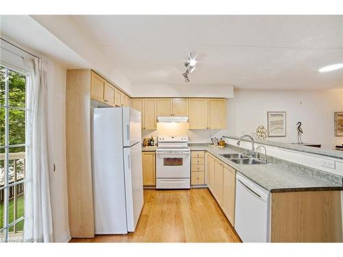 210-1460 Bishops Gate, Oakville, ON - Indoor Photo Showing Kitchen With Double Sink