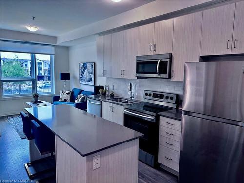 204-1105 Leger Way, Milton, ON - Indoor Photo Showing Kitchen With Double Sink