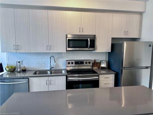 204-1105 Leger Way, Milton, ON - Indoor Photo Showing Kitchen With Double Sink With Upgraded Kitchen