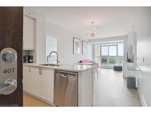 407-2480 Prince Michael Drive, Oakville, ON - Indoor Photo Showing Kitchen With Double Sink