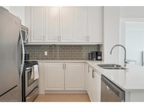 407-2480 Prince Michael Drive, Oakville, ON - Indoor Photo Showing Kitchen With Stainless Steel Kitchen With Double Sink With Upgraded Kitchen