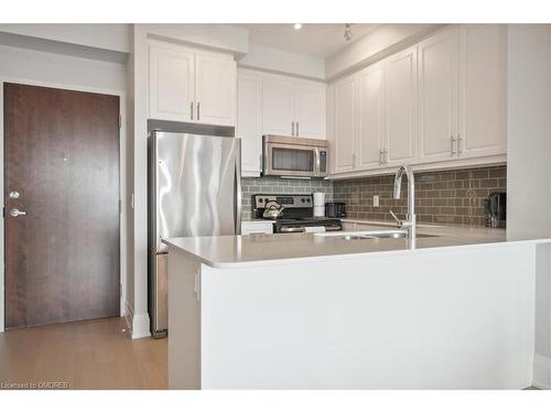 407-2480 Prince Michael Drive, Oakville, ON - Indoor Photo Showing Kitchen With Stainless Steel Kitchen With Double Sink