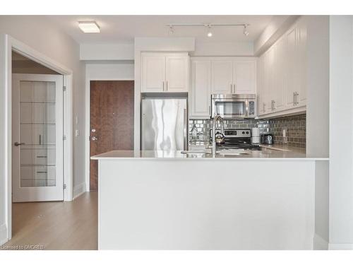 407-2480 Prince Michael Drive, Oakville, ON - Indoor Photo Showing Kitchen With Double Sink