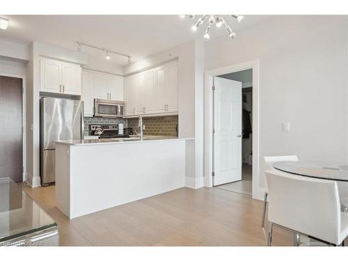 407-2480 Prince Michael Drive, Oakville, ON - Indoor Photo Showing Kitchen With Stainless Steel Kitchen