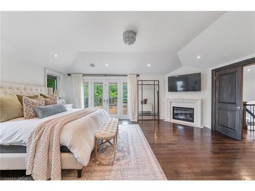 3064 St Clair Avenue, Burlington, ON - Indoor Photo Showing Bedroom With Fireplace