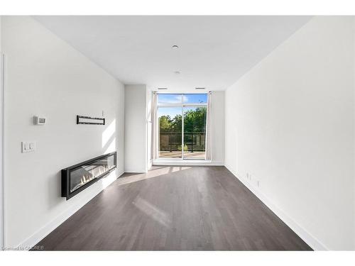 404-1575 Lakeshore Road W, Mississauga, ON - Indoor With Fireplace