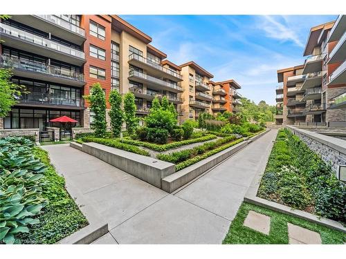 404-1575 Lakeshore Road W, Mississauga, ON - Outdoor With Balcony With Facade