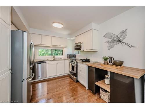 1-1250 Marlborough Court, Oakville, ON - Indoor Photo Showing Kitchen With Stainless Steel Kitchen With Double Sink