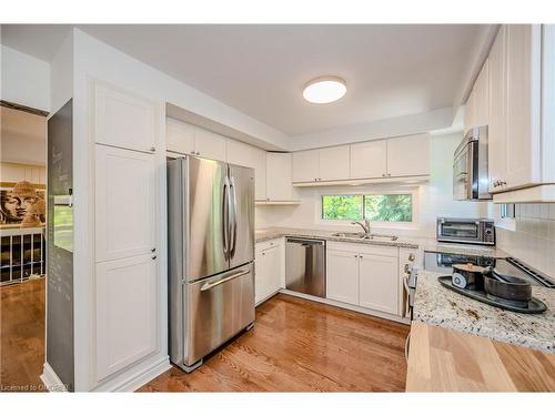 1-1250 Marlborough Court, Oakville, ON - Indoor Photo Showing Kitchen With Stainless Steel Kitchen With Double Sink