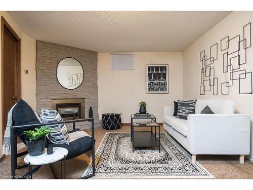 79 Ironstone Drive, Cambridge, ON - Indoor Photo Showing Living Room With Fireplace