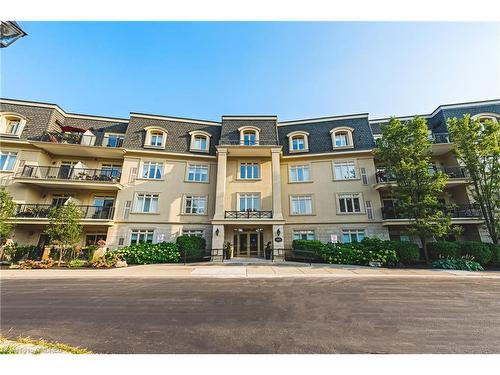 302-443 Centennial Forest Drive, Milton, ON - Outdoor With Balcony With Facade