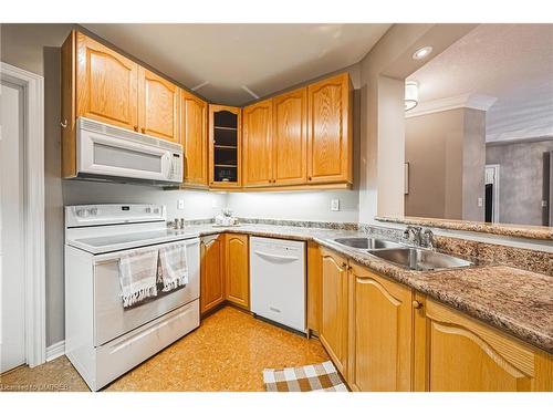 302-443 Centennial Forest Drive, Milton, ON - Indoor Photo Showing Kitchen With Double Sink